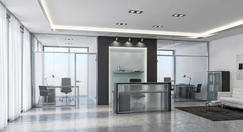 Partitions built by the Almashhad Sky team: Silver-framed glass rooms and a dark wall